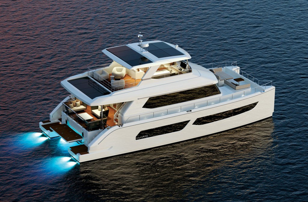 A high-angle, overhead rendering of a luxurious, modern white ILIAD 60 power catamaran cruising at dusk. The multi-deck vessel features large solar panels integrated into its upper hardtop roof and aft awning cover. The aft cockpit and open flybridge area are elegantly furnished with outdoor lounge chairs and sofas. Bright blue underwater LED lights glow vividly beneath the swimming platform at the stern, casting a vibrant reflection onto the calm dark water.