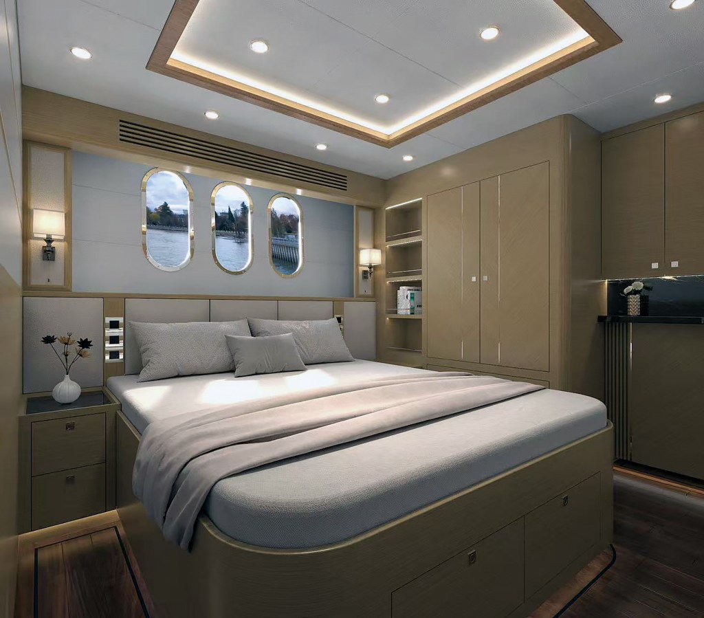 An interior rendering of a master stateroom aboard a Selene 52 Ocean Explorer, featuring a large island berth with built-in storage drawers, warm wood cabinetry, modern recessed ceiling lighting, and three distinctive vertical oval portholes over the headboard.