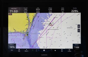 feat_AIS A Garmin marine chartplotter display screen showing a digital nautical map with AIS vessel tracking, route waypoints, and navigation data overlay.