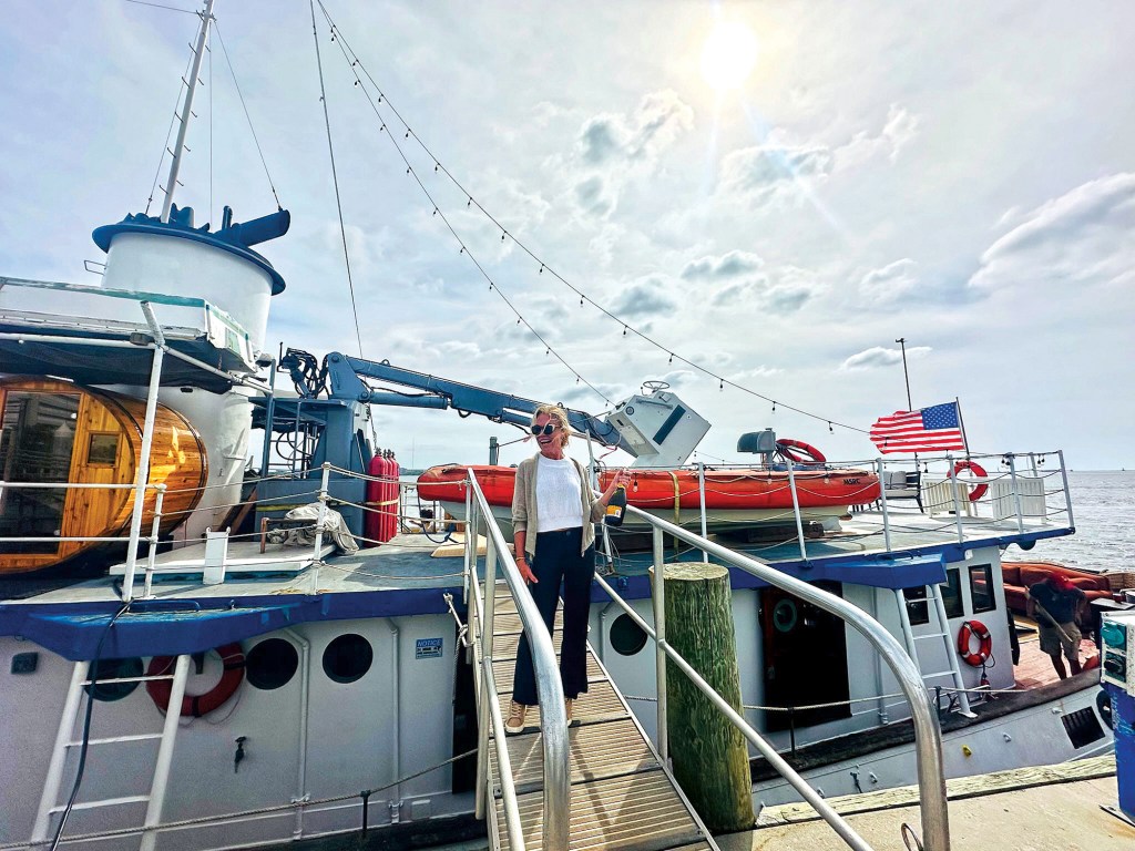 Leila Davenport Ross standing on the gangway boarding the historic Robert Gray ship.