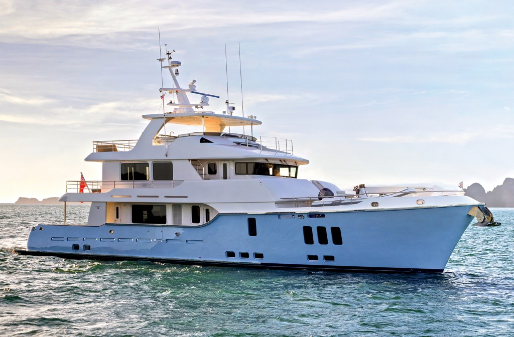feat-Nordhavn_100 Profile view of a light blue Nordhavn 100 expedition yacht underway on open water.